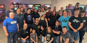 A group of people standing in front of pinball machines