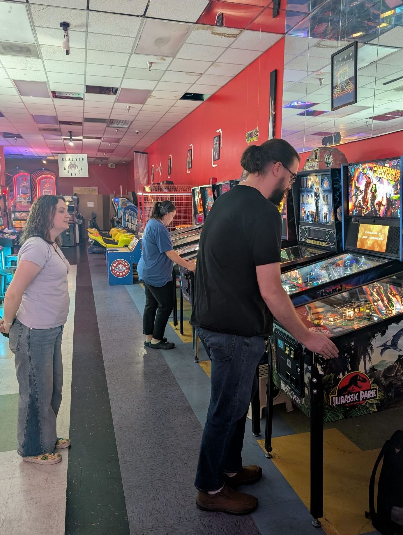 A person standing behind their opponent, out of their peripheral vision, and a respectful distance away from their opponent. 